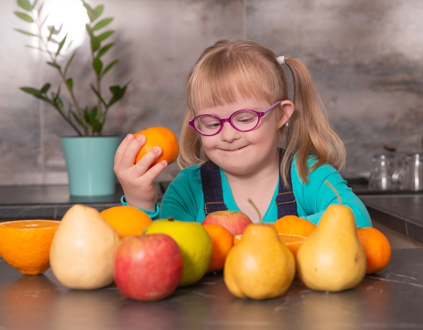 Girl holding fruit